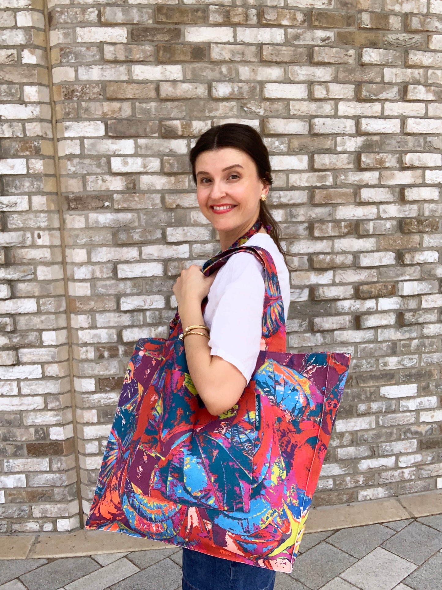 LANYA TROPICANA SUNDOWN ORCHADIA PRINT ORGANIC COTTON CANVAS TOTE BAF AS WORN SIDE CLOSEUP