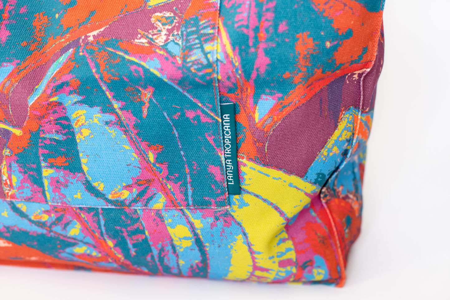 LANYA TROPICANA SUNDOWN ORCHADIA PRINT ORGANIC COTTON CANVAS TOTE BAG BOTTOM CORNER