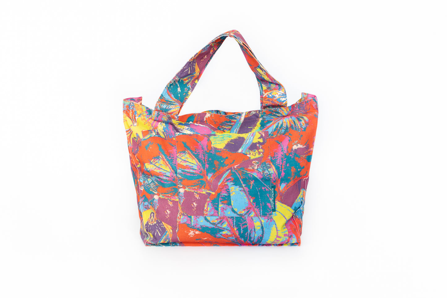 LANYA TROPICANA SUNDOWN ORCHADIA PRINT ORGANIC COTTON CANVAS TOTE BAG FRONT WHITE BACKGROUND