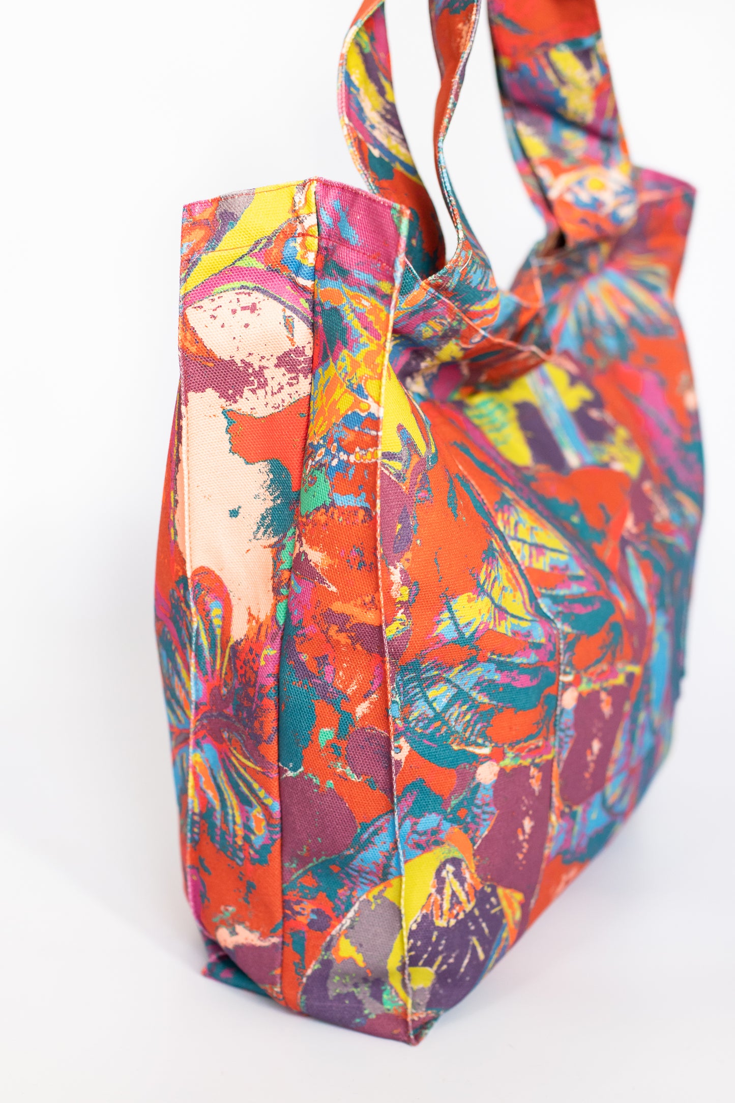 LANYA TROPICANA SUNDOWN ORCHADIA PRINT ORGANIC COTTON CANVAS TOTE BAG SIDE PANEL WHITE BACKGROUND