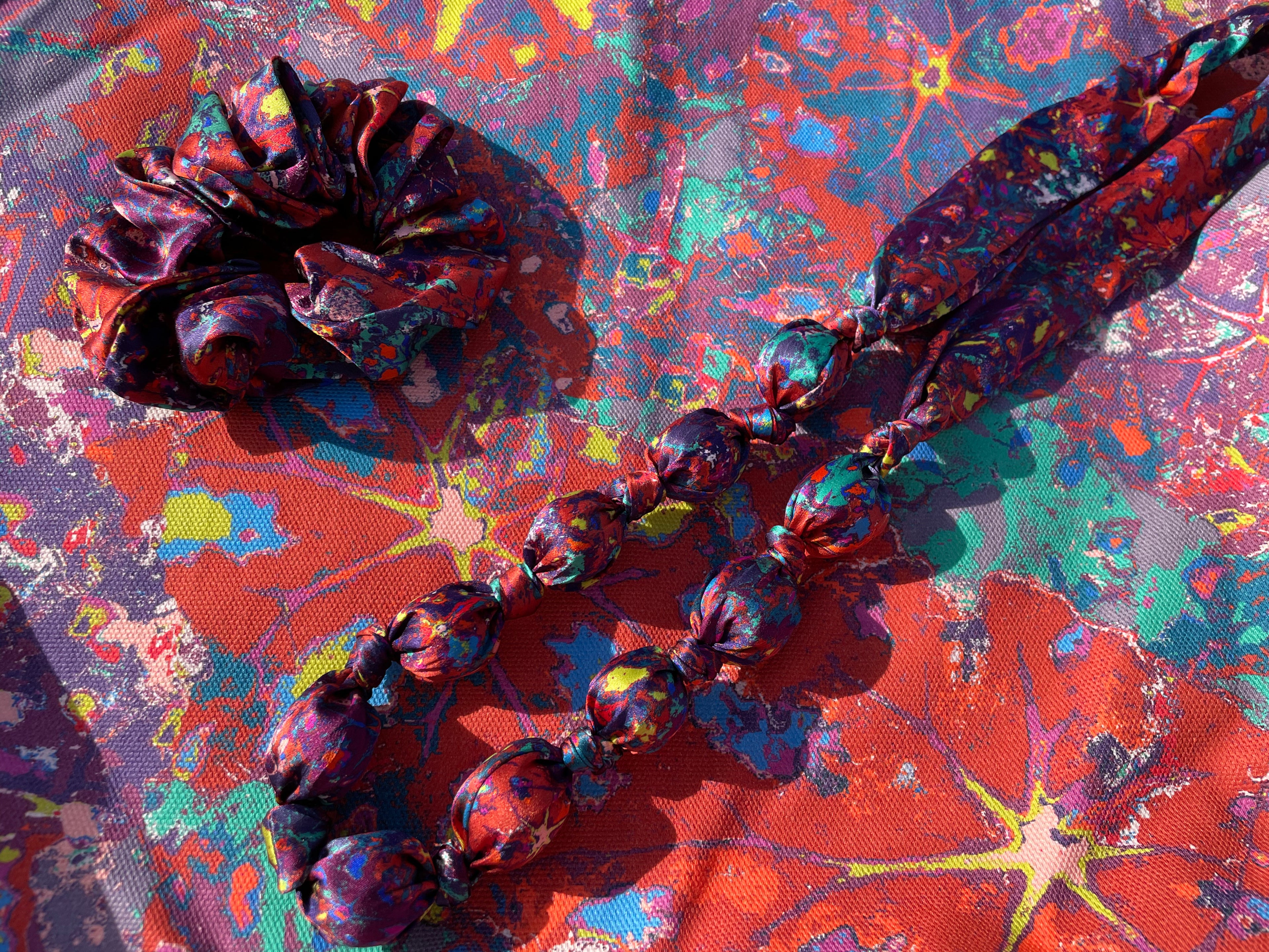 LANYA_TROPICANA_SUNDOWN_REEF_PRINTED_ORGANIC_SILK_NECKLACE_SCRUNCHIE_ORGANIC_CANVAS_TOTE_BAG_UPCLOSE