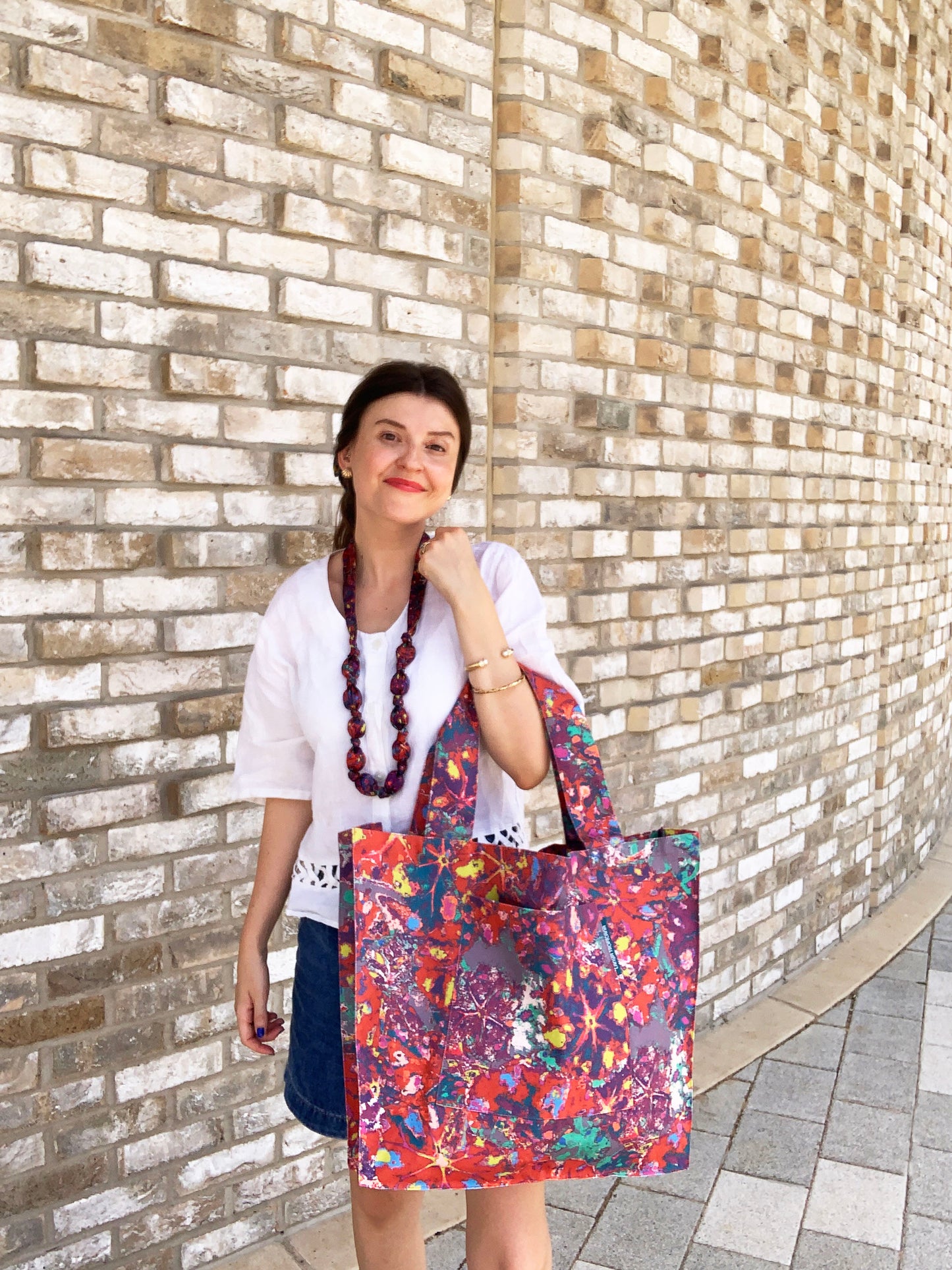 LANYA TROPICANA SUNDOWN REEF PRINT ORGANIC COTTON CANVAS TOTE BAG AS WORN FRONT ARM