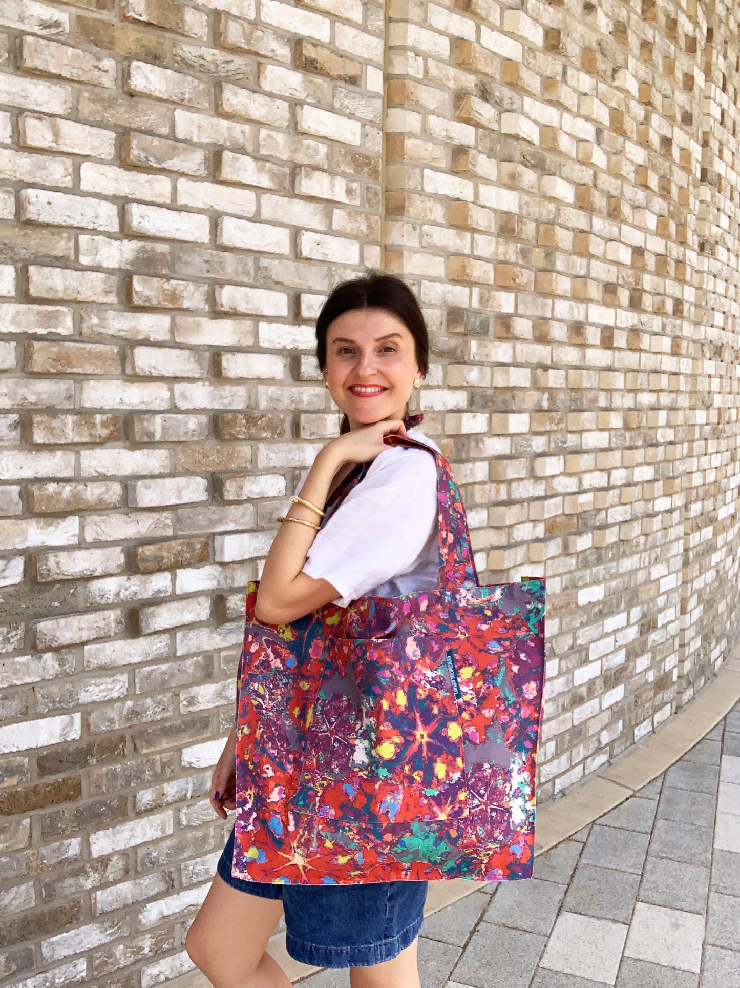 LANYA TROPICANA SUNDOWN REEF PRINT ORGANIC COTTON CANVAS TOTE BAG WORN SIDE ANGLE