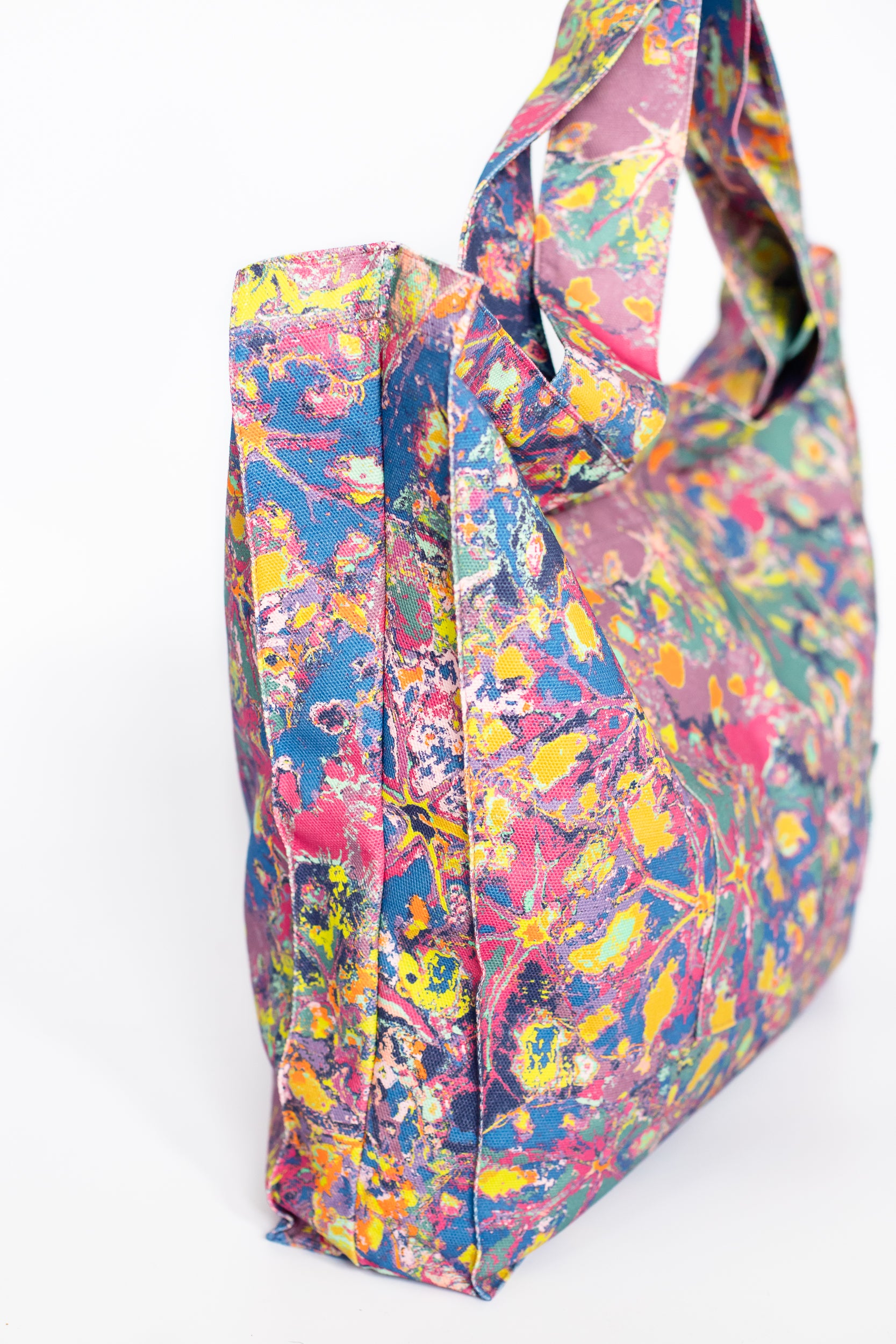 LANYA TROPICANA ZEST REEF PRINTED ORGANIC COTTON CANVAS COLOURFUL MAXIMAL SUSTAINABLE TOTE BAG SIDE ANGLE